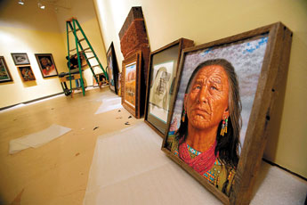 Preparation commences for the Jimmy Abeita exhibit at the Navajo Nation Museum in Window Rock on Tuesday. &copy; 2011 Gallup Independent / Adron Gardner 